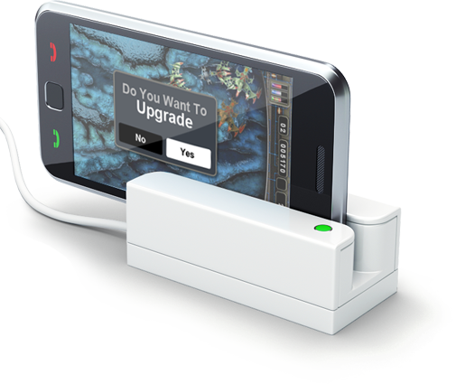 Phone in docking station, upgrade prompt visible.